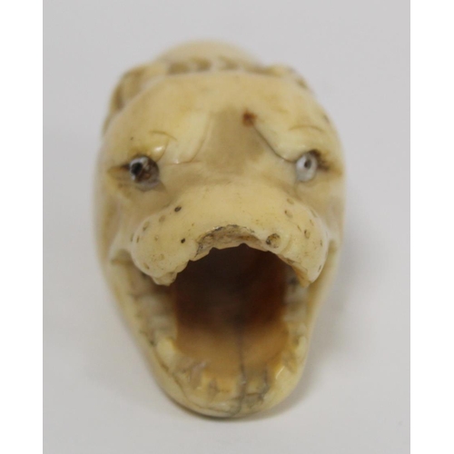 341 - 19th century ivory walking stick finial in the form of a leopard's head, 5.5cm long and two other fi... 