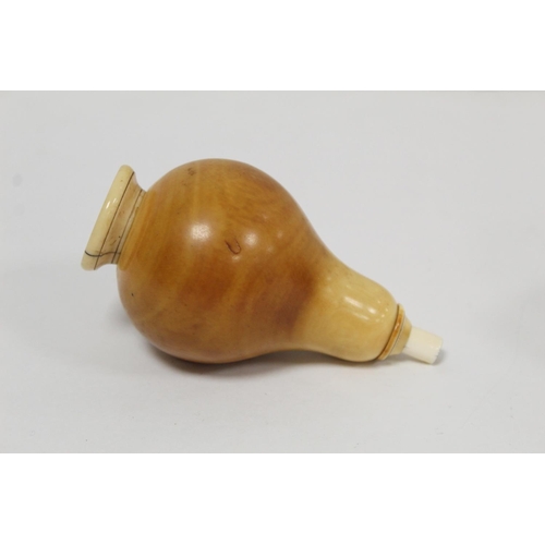 349 - Unusual antique ivory turned vessel of pear form with screw top and base and sprung column, probably... 