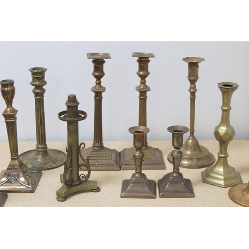 383 - Pair of brass candlesticks with reeded columns and square plinth base; pair of Georgian desk candles... 