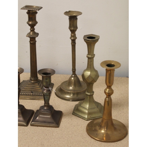 383 - Pair of brass candlesticks with reeded columns and square plinth base; pair of Georgian desk candles... 