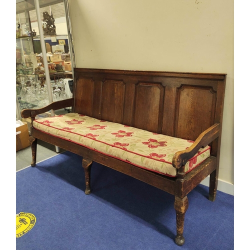 544 - 18th century oak settle, four panel back rest, slatted seat, on cabriole front supports, with scroll... 