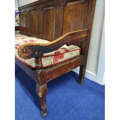 544 - 18th century oak settle, four panel back rest, slatted seat, on cabriole front supports, with scroll... 