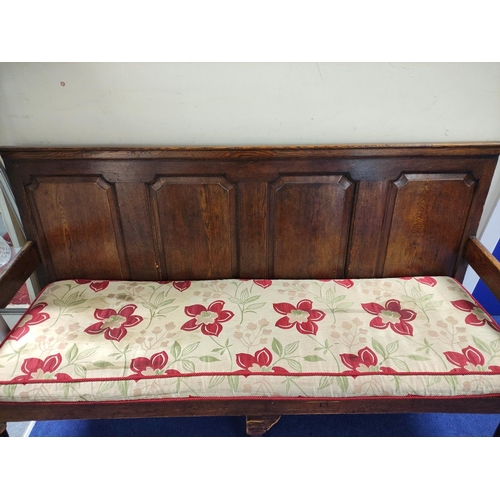 544 - 18th century oak settle, four panel back rest, slatted seat, on cabriole front supports, with scroll... 