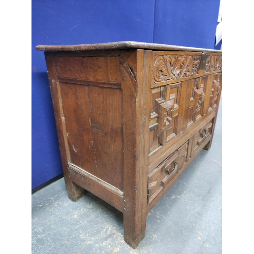 557 - William & Mary oak coffer, with a carved panelled front, bearing inscription ER and dated 1696, ... 