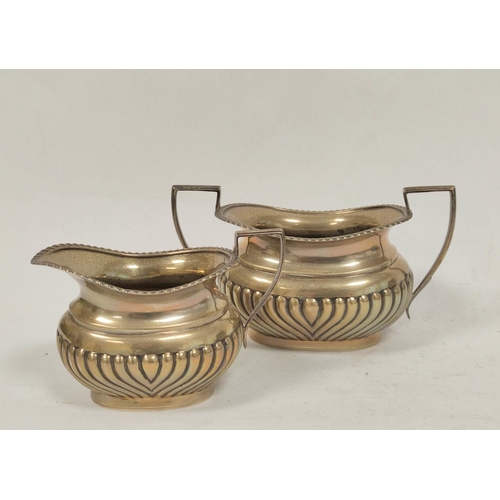 20 - Silver three piece tea set of boat shape, part fluted, Birmingham, 1911, 829g / 25oz.