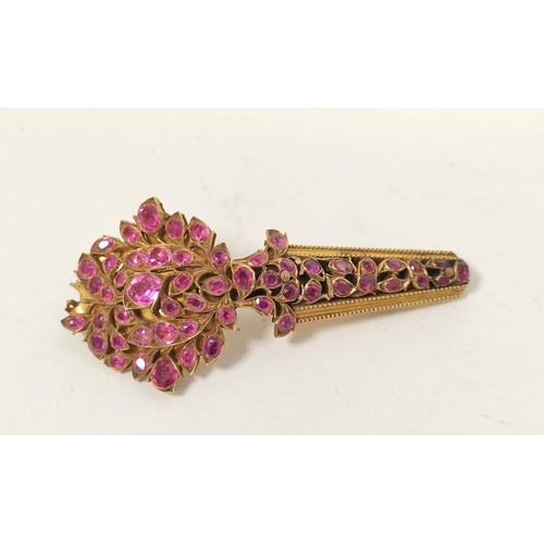 23 - Indian 19th century yellow gold turban pin, pave set with sprays of rubies, now 7.4cm, 23g gross.