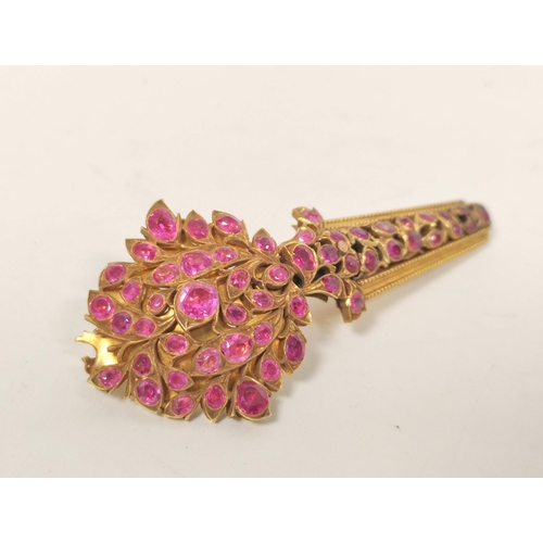 23 - Indian 19th century yellow gold turban pin, pave set with sprays of rubies, now 7.4cm, 23g gross.