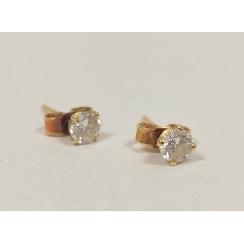 57 - Pair of diamond earrings, each a brilliant approx .25ct in gold.