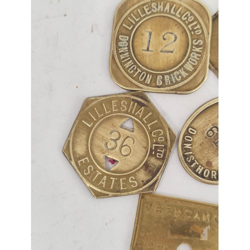 176 - Collection of brass colliery pit checks & retailers tokens to include Newstead Colliery, Coatgra... 