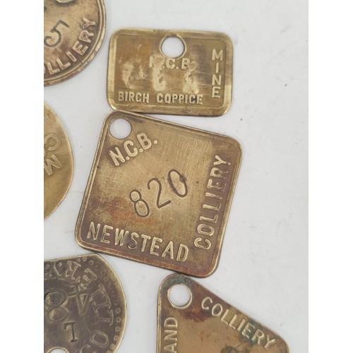 176 - Collection of brass colliery pit checks & retailers tokens to include Newstead Colliery, Coatgra... 