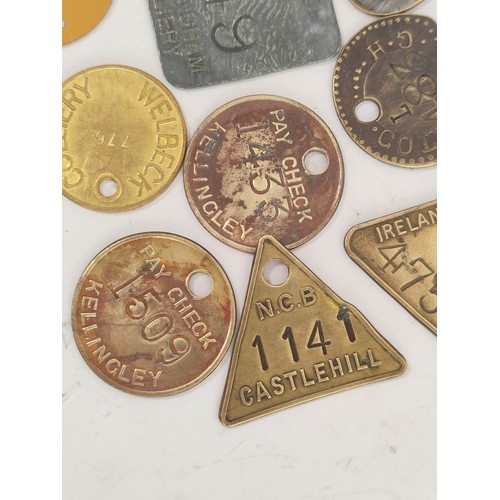 176 - Collection of brass colliery pit checks & retailers tokens to include Newstead Colliery, Coatgra... 