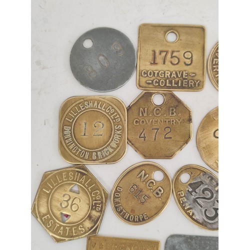 176 - Collection of brass colliery pit checks & retailers tokens to include Newstead Colliery, Coatgra... 