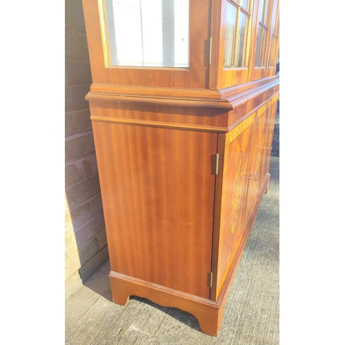 565 - Reproduction mahogany display cabinet with three astragal glazed doors above a lower cupboard crossb... 