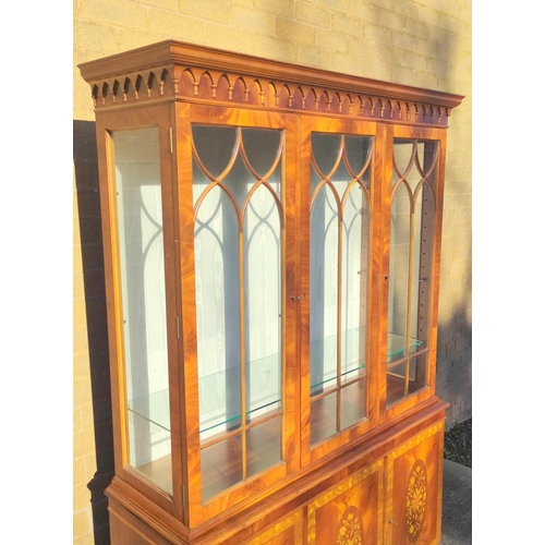 565 - Reproduction mahogany display cabinet with three astragal glazed doors above a lower cupboard crossb... 