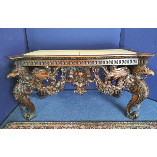 562 - Impressive walnut console table base on scroll supports profusely carved with grotesque birds at eac... 