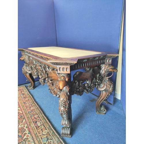 562 - Impressive walnut console table base on scroll supports profusely carved with grotesque birds at eac... 