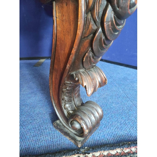 562 - Impressive walnut console table base on scroll supports profusely carved with grotesque birds at eac... 