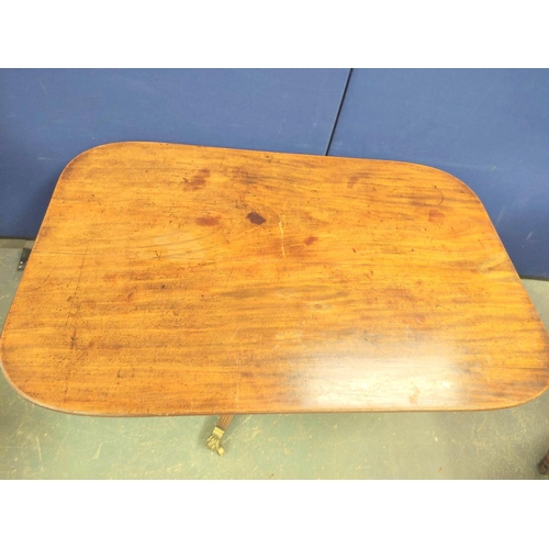 566 - 19th century mahogany tilt top breakfast table raised on a turned column and quadruped feet with bra... 