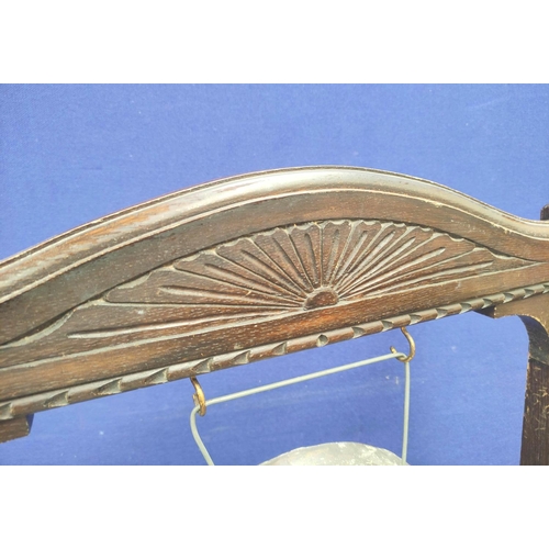 568 - Antique 1920s service gong with a ark oak frame carved with oriental motifs. Complete with beater. 1... 