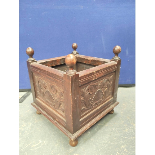 569 - Antique oak jardinière stand with carved shell and foliate panels & turned orb finials. 46cm hig... 