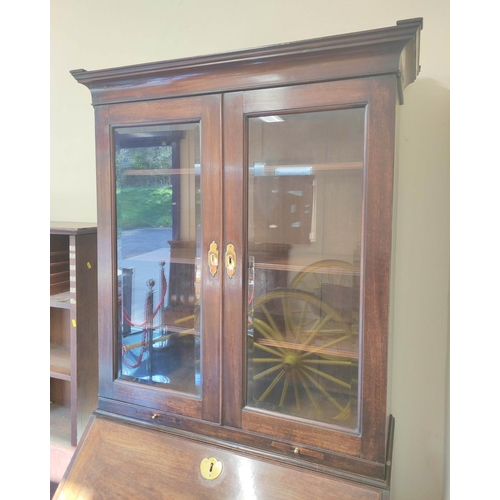 573 - Mid 18th century red walnut bureau bookcase with  glazed doors above a fall-front enclosing fitted i... 