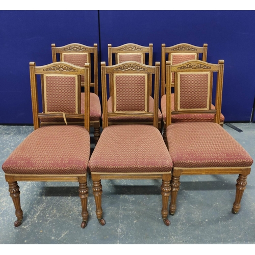 576 - Set of eight late Victorian dining chairs and a similar parlour armchair, each with pink geometric u... 