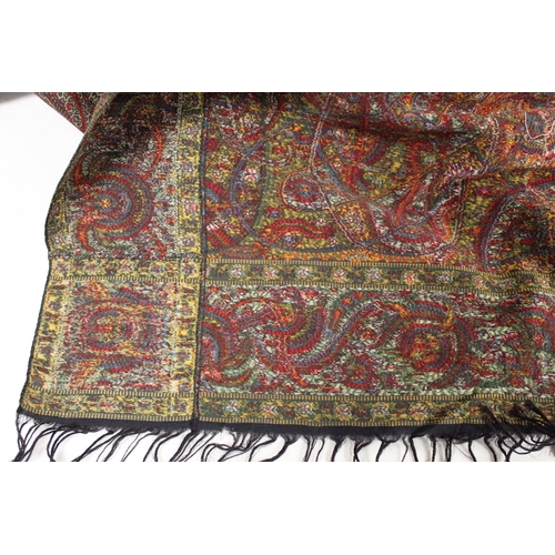 412 - Large Victorian paisley wool shawl, the black field with woven polychrome borders of boteh, some dar... 