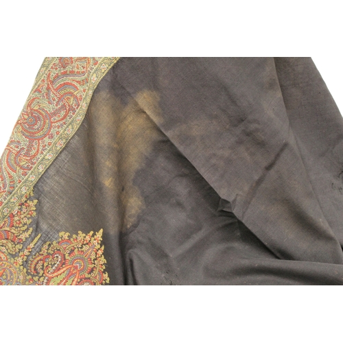 412 - Large Victorian paisley wool shawl, the black field with woven polychrome borders of boteh, some dar... 