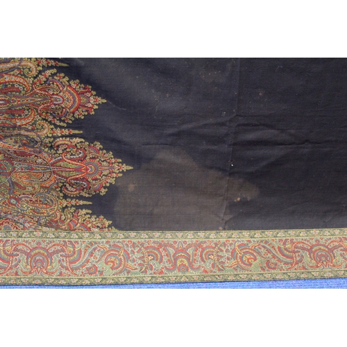 412 - Large Victorian paisley wool shawl, the black field with woven polychrome borders of boteh, some dar... 