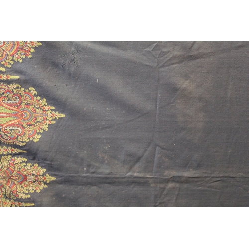 412 - Large Victorian paisley wool shawl, the black field with woven polychrome borders of boteh, some dar... 