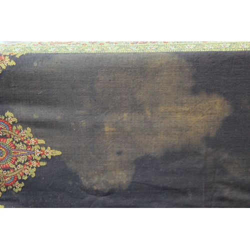 412 - Large Victorian paisley wool shawl, the black field with woven polychrome borders of boteh, some dar... 