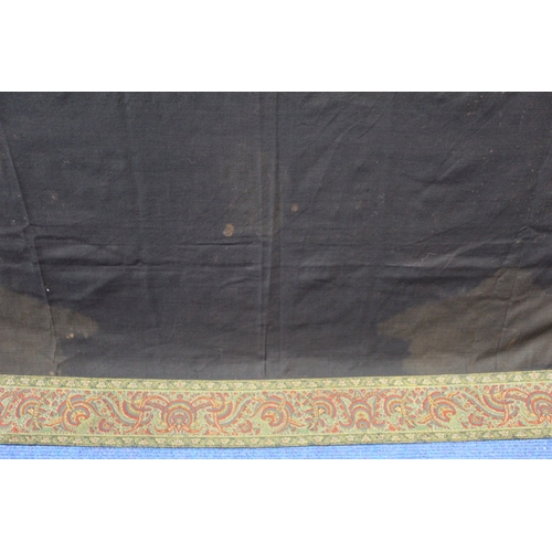 412 - Large Victorian paisley wool shawl, the black field with woven polychrome borders of boteh, some dar... 