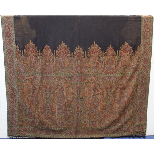 412 - Large Victorian paisley wool shawl, the black field with woven polychrome borders of boteh, some dar... 