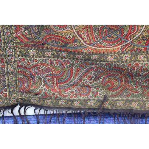 412 - Large Victorian paisley wool shawl, the black field with woven polychrome borders of boteh, some dar... 