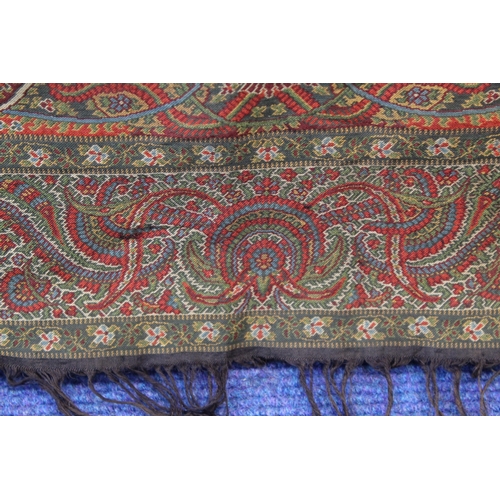 412 - Large Victorian paisley wool shawl, the black field with woven polychrome borders of boteh, some dar... 