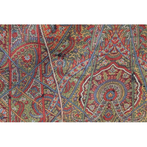 412 - Large Victorian paisley wool shawl, the black field with woven polychrome borders of boteh, some dar... 