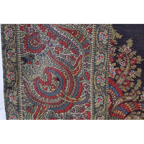 412 - Large Victorian paisley wool shawl, the black field with woven polychrome borders of boteh, some dar... 