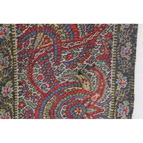 412 - Large Victorian paisley wool shawl, the black field with woven polychrome borders of boteh, some dar... 