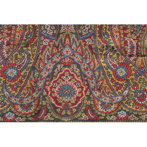 412 - Large Victorian paisley wool shawl, the black field with woven polychrome borders of boteh, some dar... 