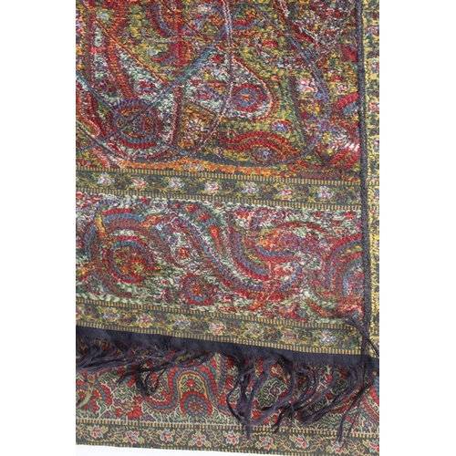 412 - Large Victorian paisley wool shawl, the black field with woven polychrome borders of boteh, some dar... 