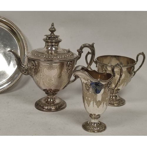 65 - Victorian ep three piece tea set of vase shape, with embossed marks and engraved scrolls, C1880 and ... 