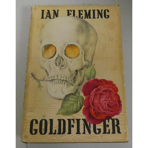 229 - FLEMING IAN.  Goldfinger. Orig. dark cloth with gold coin eyes in d.w. 1st ed., Jonathan C... 