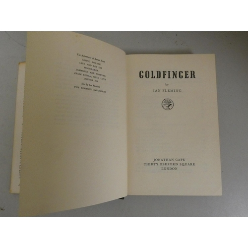 229 - FLEMING IAN.  Goldfinger. Orig. dark cloth with gold coin eyes in d.w. 1st ed., Jonathan C... 