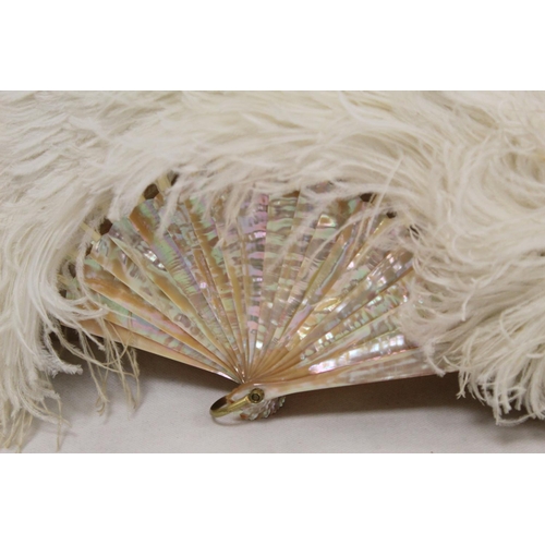 417 - Large 19th century white ostrich feather fan with mother of pearl sticks, approx. 77cm wide, in J. D... 