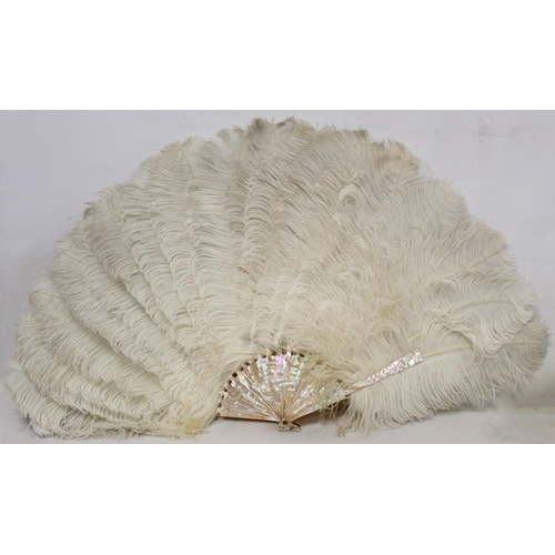 417 - Large 19th century white ostrich feather fan with mother of pearl sticks, approx. 77cm wide, in J. D... 