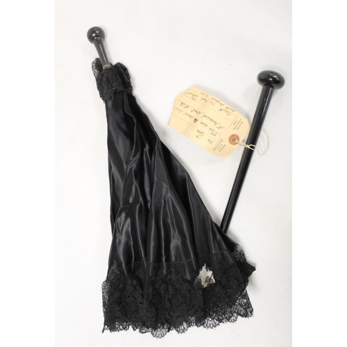 418 - Victorian black satin parasol with lace edging, cream silk lining and ebonised tapered handle and kn... 