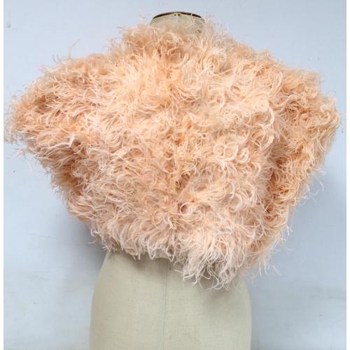 428 - Early 20th century bolero jacket of apricot ostrich feather with satin lining and ribbon tie.