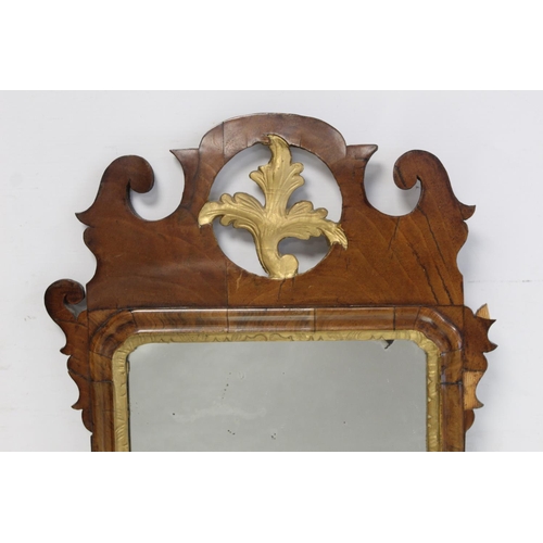 179 - George III style wall mirror with fret cut walnut veneered frame, pierced foliate pediment and mould... 