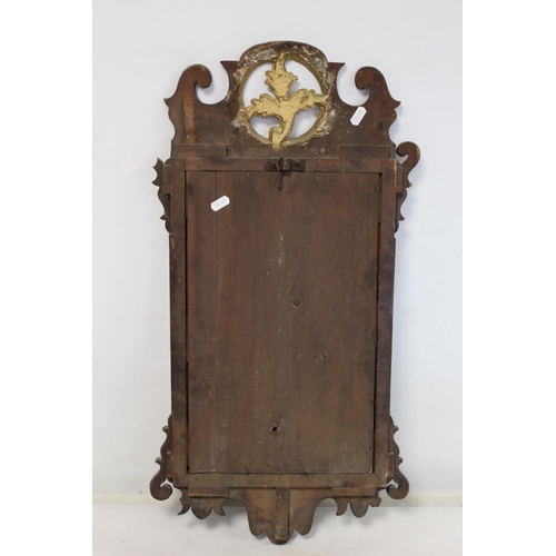 179 - George III style wall mirror with fret cut walnut veneered frame, pierced foliate pediment and mould... 