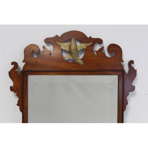 180 - George III style mahogany veneered wall mirror with fret cut frame, pierced bird pediment and bevell... 